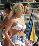 Beautiful slim blonde wearing bikini and torn denim shorts (7)