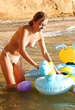blond_young_girl_bathing_nude_in_the_sea (24/25)