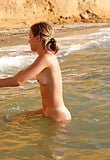 blond_young_girl_bathing_nude_in_the_sea (10/25)