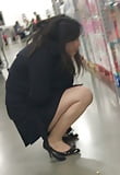 Young_Chinese_milf_getting_her_squats_done_at_store  (3/25)