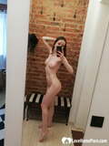 Short_brunette_takes_selfies_while_stripping_ _posing_sexily_in_the_mirror (9/20)