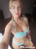 Beautiful amateur doll takes selfies while posing in her turquoise lingerie (12)