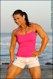 Brunette bodybuilder Lada Phihalova flexes at the beach in a tank top & shorts (15)