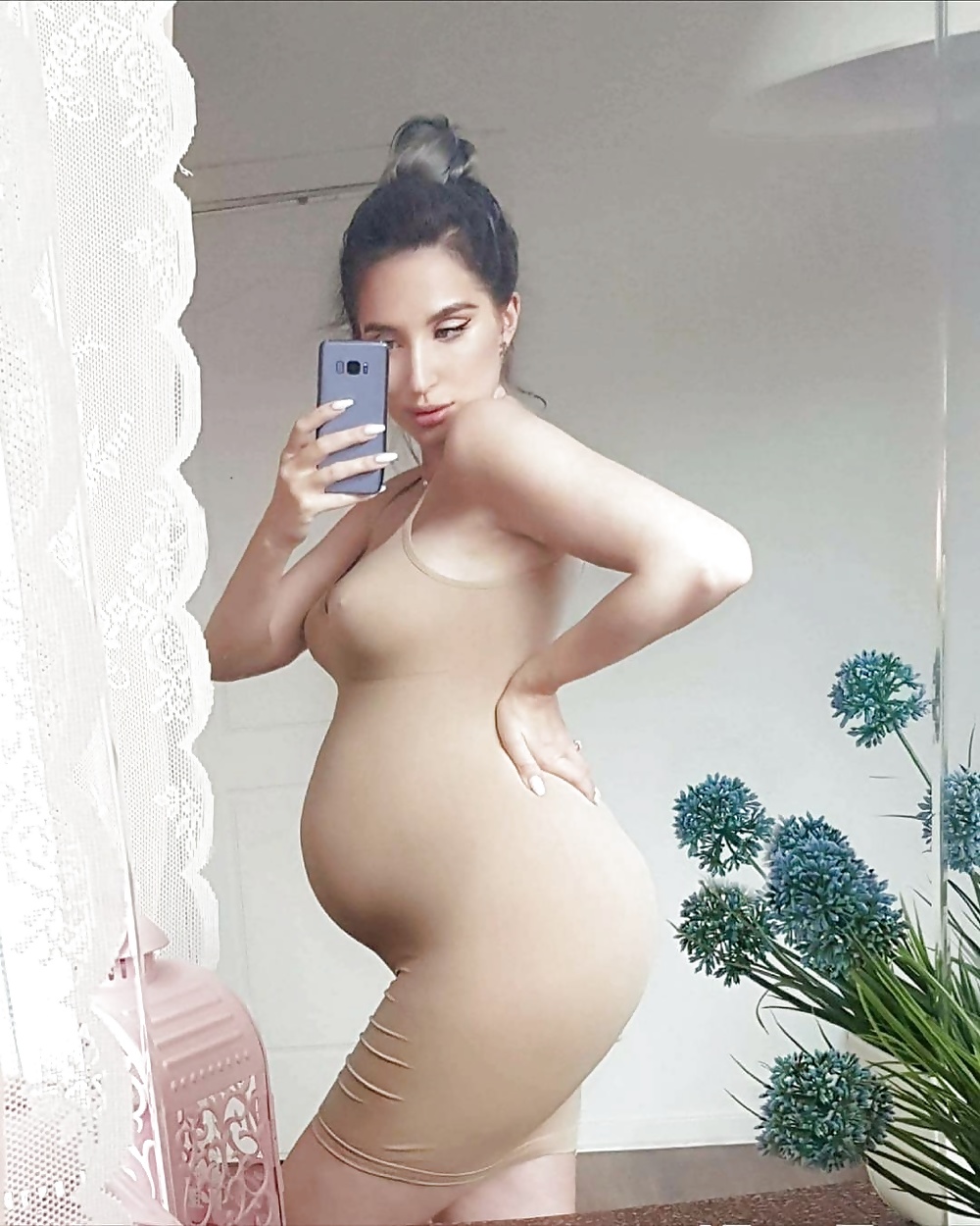Sexy pregnant belly.