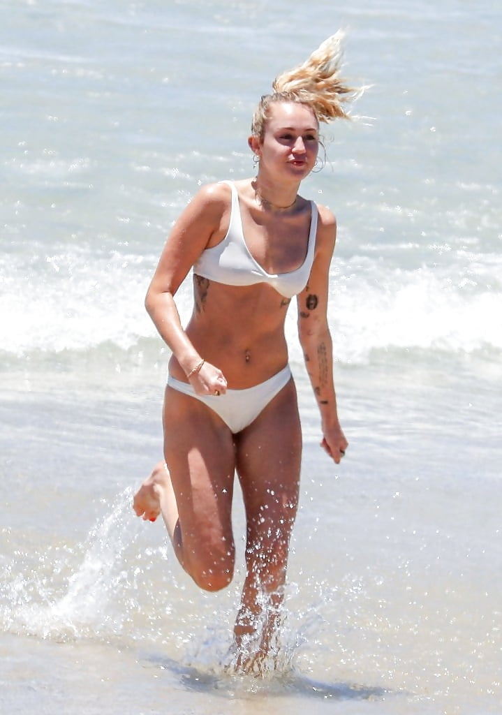 Miley_Cyrus__wears_a_white_bikini_on_the_beach (10/17)