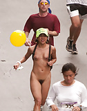 Young_Asian_girl_running_nude_among_clothed_people (2/3)