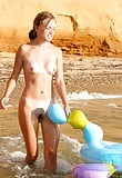 blond_young_girl_bathing_nude_in_the_sea (21/25)