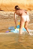 blond_young_girl_bathing_nude_in_the_sea (18/25)