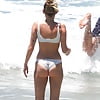 Miley Cyrus  wears a white bikini on the beach (17)