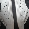 White Gucci shoes. (9)